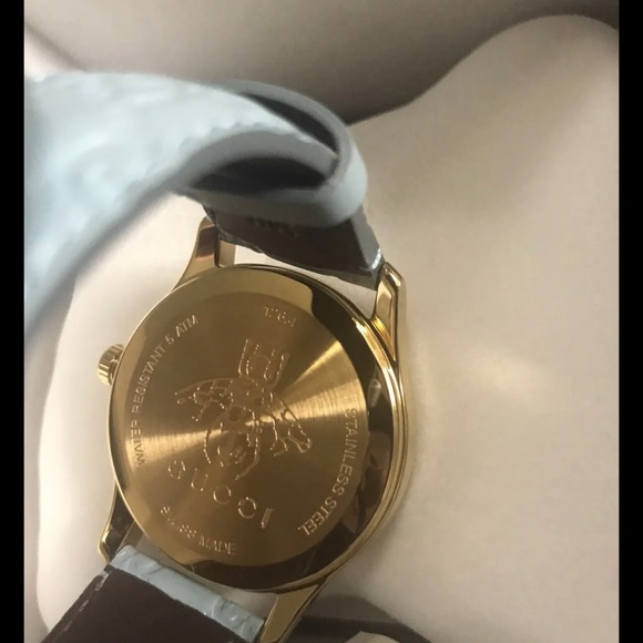 GUCCI WOMENSWEAR G-TIMELESS SIGNATURE LEATHER STRAP WATCH BABY BLUE AND GOLD - Picture 5 of 9